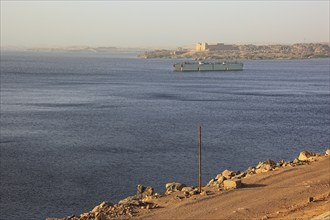 View from the dam across the Nile to the Temple of Isis at Philae on the island of Agilkia, Africa,