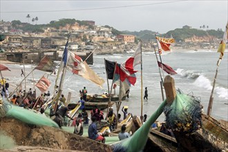 Traditional wooden fishing boats in the fishing harbour of Cape Coast, Cabo Corso, Ghana, West