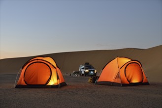 Tents in the Nubian Desert in the evening light, near Dongola, Northern State, Nubia, Sudan, Africa