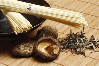 Chinese noodles, hoisin spaghetti, dried shitake mushrooms, and dried, sliced judaso ear mushrooms,