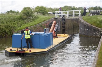 Maintenance boat at Caen Hill flight of locks on the Kennet and Avon canal Devizes, Wiltshire,