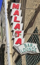 Old neon sign for Malata bar and lounge in Strait Street, Valletta, Malta, Europe