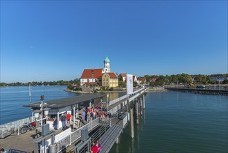 Moated castle, Lake Constance, kiosk, jetty, tourists, parish church of St George, onion dome,