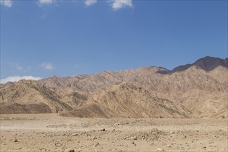 Red mountains, rocks and blue sky. Egypt, the Sinai Peninsula, Dahab