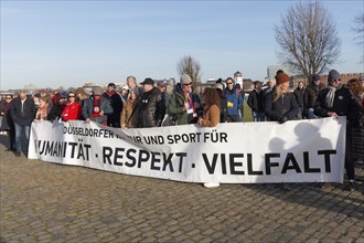 People holding banner, inscription Humanity, Respect, Diversity, large demonstration against