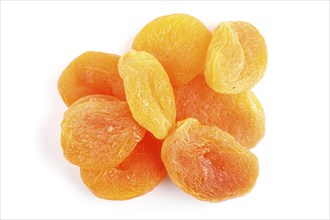 Pile of dried apricots isolated on white background. top view