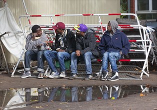 Refugees from Syria waiting to be registered at the Central Reception Centre for Asylum Seekers at