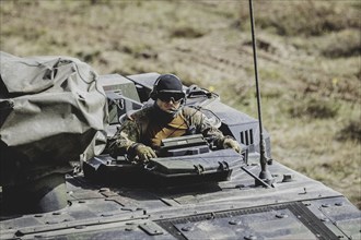 A soldier in a Boxer armoured transport vehicle, photographed as part of a Bundeswehr exercise with