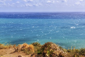 View of turquoise sea, horizon, coastline at La Isleta, sunny weather, typical light mood,