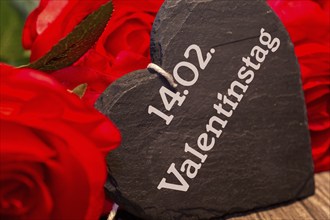 Reminder for Valentine's Day: roses and a heart with the inscription 14.02. VALENTINE'S DAY