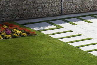 Beautiful stone terrace in a well-tended ornamental garden