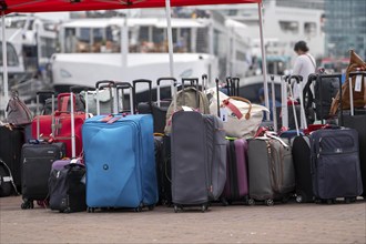 Luggage waiting to be loaded onto river cruise ships at Viking Cruise Port Amsterdam, Netherlands