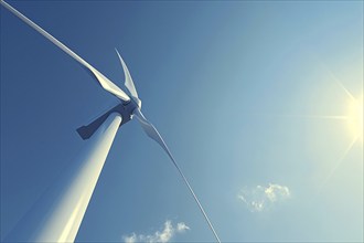 View of wind mill turbine in front of blue sky from the ground. Generative Ai, AI generated