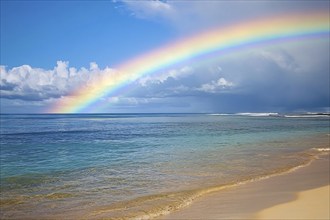 Beach with ocean and rainbow. Generative AI, AI generated