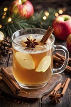 Steaming apple cider in a glass mug, garnished with a cinnamon stick and star anise, surrounded by