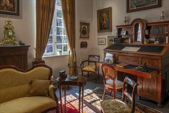 Antique, secretary desk inside 18th century clergy house Schriek at recreated village in open air