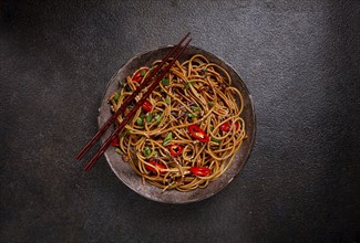 Udon noodles, with shimeji mushrooms, vegetables, in sauce, with sesame seeds, green onions, Asian