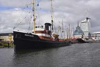 Bremerhaven, Maritime Museum, tug Seefalke, on the open-air site, view of the Outlet Centre and