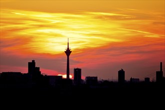 City skyline at colourful sunset with Rhine Tower, Düsseldorf, North Rhine-Westphalia. Germany