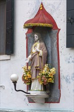 Chistus figure under a canopy on a house, Burano, Veneto, Italy, Europe