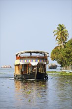 Traditional houseboat on Lake Vembanad, canal system of the backwaters, Kerala, India, Asia