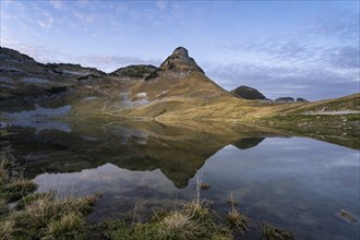 Lake Augstsee and the Atterkogel mountain on the Loser. Autumn, good weather, blue sky. In the