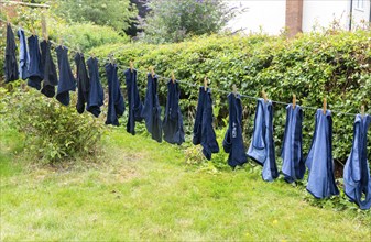 Washing line clothes drying row blue underpants, UK