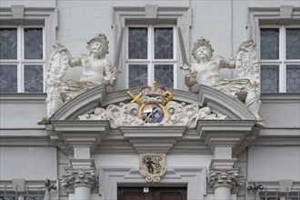 Entrance potal with sculptures and coat of arms of the baroque town hall, built in 1718, Iphofen,