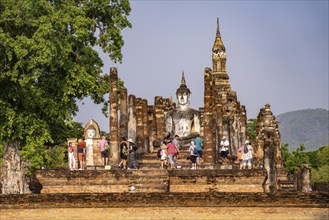 Tourists in the central Buddhist temple Wat Mahathat, UNESCO World Heritage Sukhothai Historical