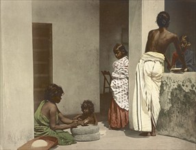 South India. Women Grinding and Children, India, digitally restored reproduction from a 19th