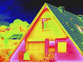 Apartment block, facade of a residential building with windows. Thermal image or thermography,