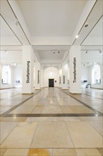 Bright exhibition hall with white walls and themed texts, University of Stuttgart, Germany, Europe