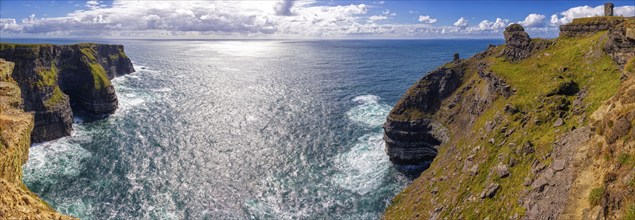 Panoramic views of majestic cliffs and sparkling sea under sunny skies, Cliffs of Moher