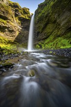 Kvernufoss waterfall, in summer when the weather is fine, gorge and river, long exposure, Skogar,