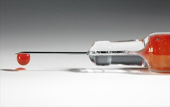 A syringe with donated blood, blood drop, Vienna, Austria, Europe