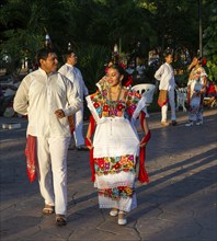 Folk dancers with bottles balanced on their heads, Francisco Cantón Rosado Park, Valladolid,