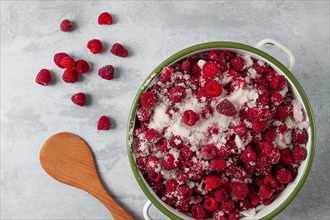 Fresh raspberry berry, covered with granulated sugar, jam preparation, top view, no people