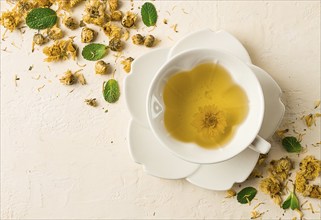 Chrysanthemum tea, drink, white cup, mint, chrysanthemum buds, close-up, no people