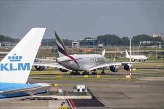 Amsterdam Schiphol Airport, aircraft at the terminal, Emirates Airbus A380 on the taxiway to the