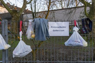 Gift fence with donations for the homeless and needy, food, hygiene articles, clothing, in Essen