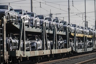 Car train, goods train on its way to the car terminal in Bremerhaven seaport, new German cars for