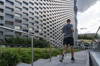 CopenHill, waste incineration plant and artificial ski slope, athletes use the stairs and paths for