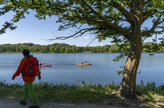 Hiking on the Baldeney Steig, a hiking trail around Lake Baldeney in Essen, a Ruhr reservoir, over