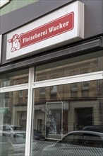 Closed butcher's shop on Ückendorfer Straße, business closed, sign in shop window Die Wurst ist