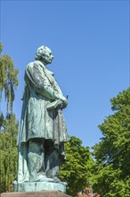 Odense, green area, Hans Christian Andersen statue, profile, Fyn, island of Funen, Denmark, Europe