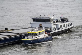 Water police boat sailing alongside a cargo ship on the Rhine near Duisburg, WSP 12, a police