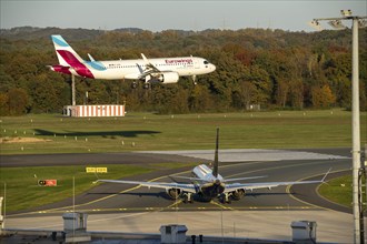 Eurowings Airbus A320neo landing at Cologne-Bonn Airport, Ryanair Boeing 737, waiting on the