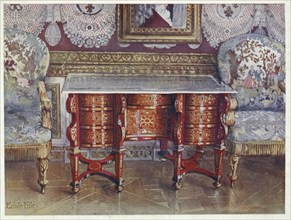 Furniture from around the turn of the century 1900, desk with kneehole in red tortoiseshell.