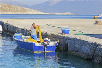 Fisherman working, Halki Island, Dodecanese Islands, Greece, Europe