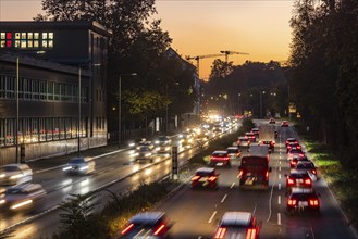 City centre street with heavy traffic in the evening. Dynamic light trails with long exposure time.